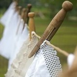 Cloth hanging on wash line with wooden clothes peg